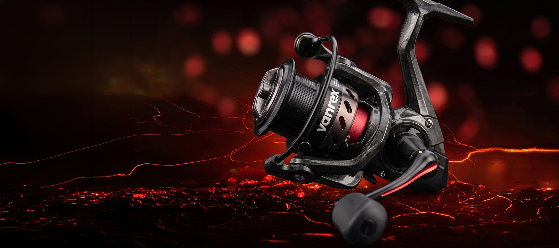 A spinning fishing reel with a black body and red accents, featuring the brand name 'VONTEX' on the spool, set against a dark, fiery background with red glowing embers.